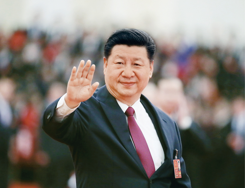 2018年3月20日,第十三届全国人民代表大会第一次会议在北京人民大会堂闭幕。当日下午,习近平等党和国家领导人同出席十三届全国人大一次会议的全体代表合影留念。这是习近平向代表挥手致意。 新华社记者 兰红光/摄